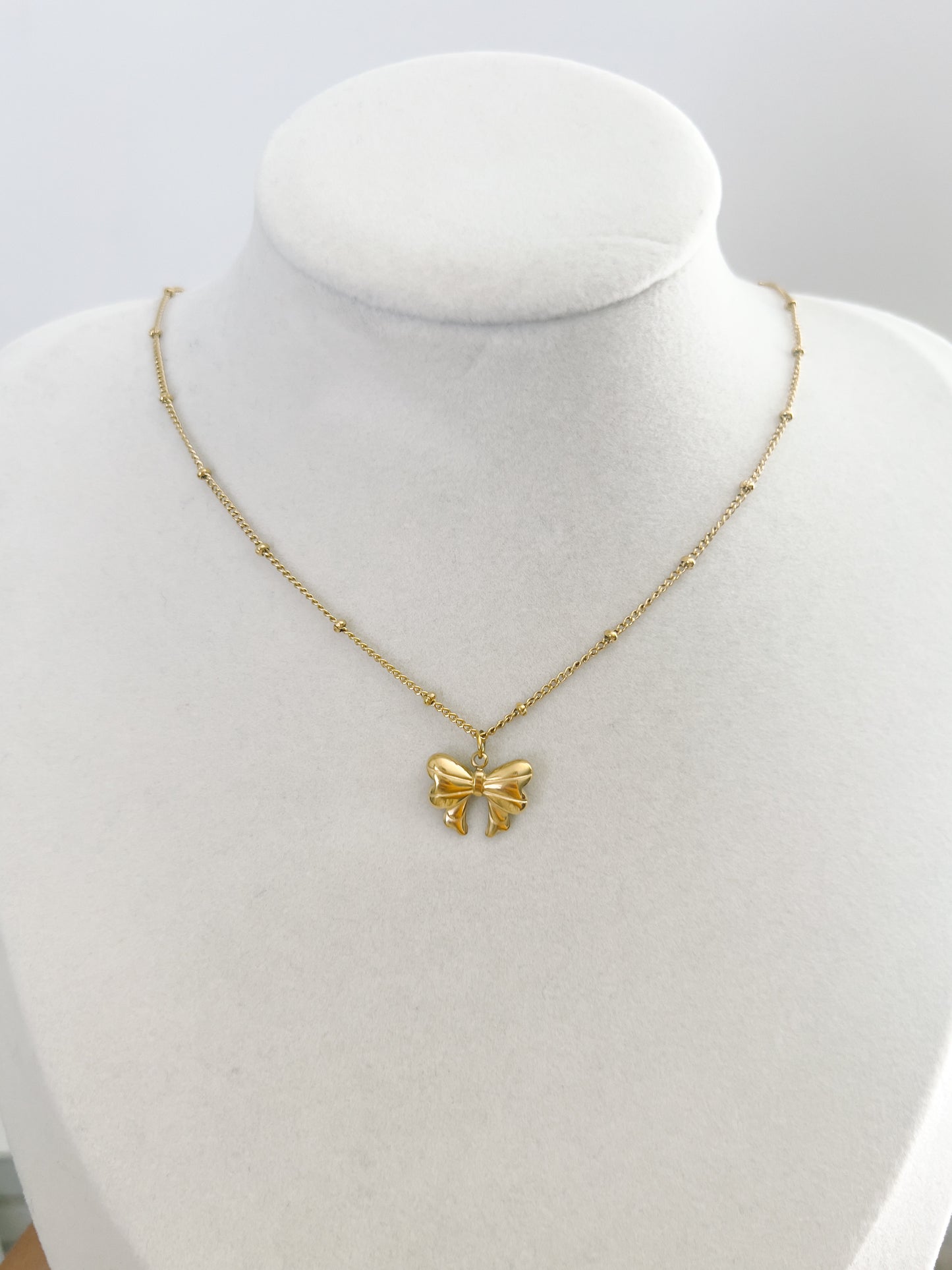 N55 GOLD BOW NECKLACE